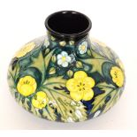A large Moorcroft Pottery vase of compressed form decorated in the Buttercup pattern designed by