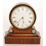 A small 19th circular mahogany cased mantle clock by Henry Marc Paris on plinth base,