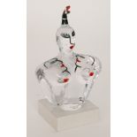 A contemporary Kosta Boda Housegod glass figure designed by Ulrica Hydman Vallien,