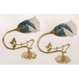 A pair of 1930s glass wall lights, the scrolled brass with foliate decoration,
