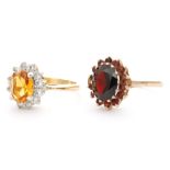 A 9ct garnet cluster ring, central oval cut garnet with garnet surround,