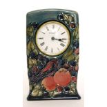 A Moorcroft Pottery mantel clock decorated in the Finches pattern designed by Sally Tuffin,