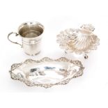 A George V hallmarked silver shell form bon bon dish with foliate decoration on three scroll feet,