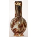 A large late 19th Century Loetz Onyx glass vase of footed globe and shaft form,