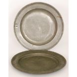 An 18th Century pewter tavern plate with raised rim stamped and dated 1754, maker A&H,