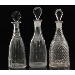 An early 19th Century glass decanter of tapering form with lozenge stopper,