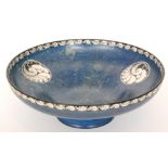 A 1920s Royal Worcester Crown Works footed bowl decorated in a mottled blue green with black and