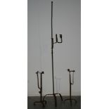 AMENDED DESCRIPTION - An 18th Century style iron floorstanding rush light holder on splayed tripod