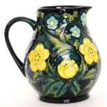 A Moorcroft Pottery baluster form jug decorated in the Buttercup pattern designed by Sally Tuffin,