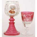 A Late 19th Century Bohemian oversized rummer glass with a conical red foot below a clear crystal