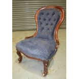 A Victorian mahogany framed easy chair,