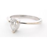 A contemporary 18ct hallmarked white gold diamond solitaire ring, pear shaped claw set diamond,