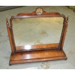 An 18th Century style cross-banded mahogany dressing table mirror, the shaped plate on turned feet,