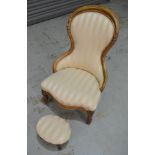 A Victorian ladies spoonback chair, with carved acanthus scroll detail to the exposed walnut frame,