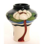 A miniature Moorcroft Pottery vase decorated in the Flower of Victoria pattern designed by Rachel
