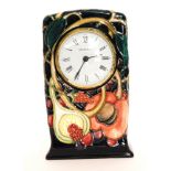A Moorcroft Pottery mantel clock decorated in the Queens Choice pattern designed by Emma Bossons,