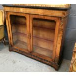 A Victorian walnut credenza with ebonised border trim and decorative gilt metal mounts,