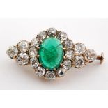 An 18ct emerald and diamond brooch,