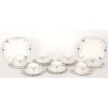 A set of six 1930s Shelley Art Deco Queen Anne shape trios decorated in the Blue Iris 15561 pattern