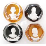 A group of four 20th Century Baccarat glass paperweights each with a central sulphide portrait,