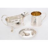 A hallmarked silver sauce boat, with a plain christening tankard and a small pin dish,