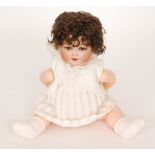 An Armand Marseille Koppelsdorf bisque head doll with open and close eyes,