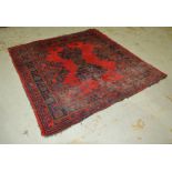 A Turkey rug with central pole medallion on a red ground,