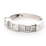 An 18ct white gold diamond half eternity ring,