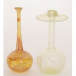 A late 19th to early 20th Century glass posy vase of globe and shaft form with wide petal edge rim