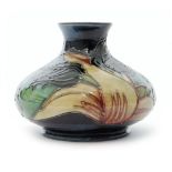 A Moorcroft Pottery vase of compressed form decorated in the Black Tulip pattern designed by Sally