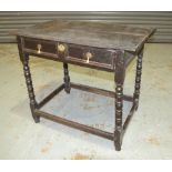 An early 18th Century oak side table, the moulded edge plank top over a single frieze drawer,