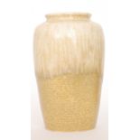 A large Ruskin Pottery crystalline glaze barrel vase decorated with a streaked pale yellow to