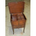 A 19th Century inlaid mahogany work table with crossbanded canted top over two drawers on splayed