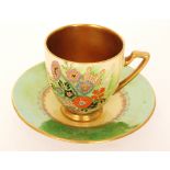 A 1930s Carlton Ware Art Deco Melon shape cup and saucer decorated in the Summer Flowers pattern,