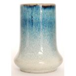 A Cobridge Pottery Elephants Foot vase glazed in a mottled blue to white glaze,