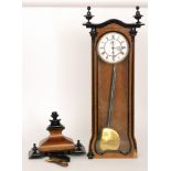 A late 19th Century walnut and part ebonised regulator weight driven wall clock enclosed by a