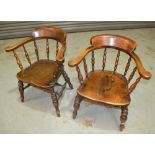 Two late 19th to early 20th Century smokers bow elbow chairs, with turned spindle backs and frames.