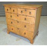 A Georgian walnut cross-banded chest of two short over three long drawers, raised to bracket feet,