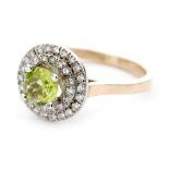 A 9ct hallmarked peridot and diamond cluster ring,