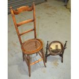 A late 19th Century childs beech ladder back correction chair on splayed legs with a cane seat,