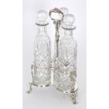 A late 19th Century silver plated three bottle decanter stand,