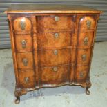 A Queen Anne style cross banded serpentine front four drawer walnut chest,