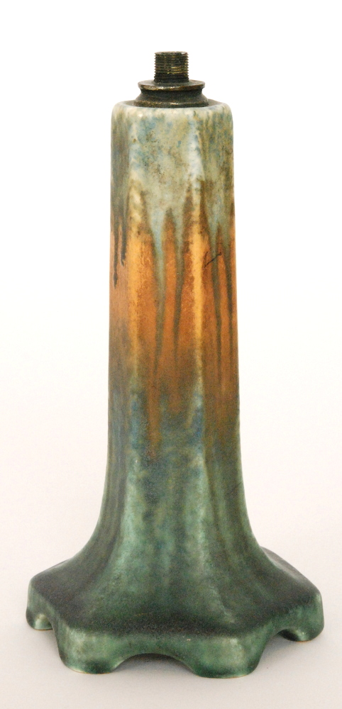 A Ruskin Pottery lamp base of hexagonal form glazed in a mottled blue to orange to green,