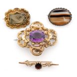 A Victorian mourning brooch, the gilt metal frame with plaited hair aperture,