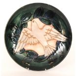 A Moorcroft Pottery 1993 cabinet year plate decorated in the Dove pattern, designed by Sally Tuffin,