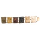 A 9ct larva cameo bracelet comprising six rectangular panels each depicting the bust of a classical