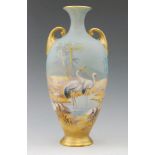 A Royal Worcester twin handled shape H287 vase decorated by George Johnson with hand painted storks