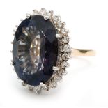 An 18ct hallmarked blueberry quartz and diamond cluster ring,