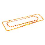 Two strands of amber beads,