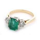 An 18ct emerald and diamond three stone ring,